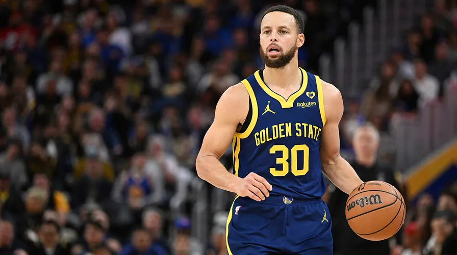 Steph Curry shooting a three-pointer for Golden State Warriors